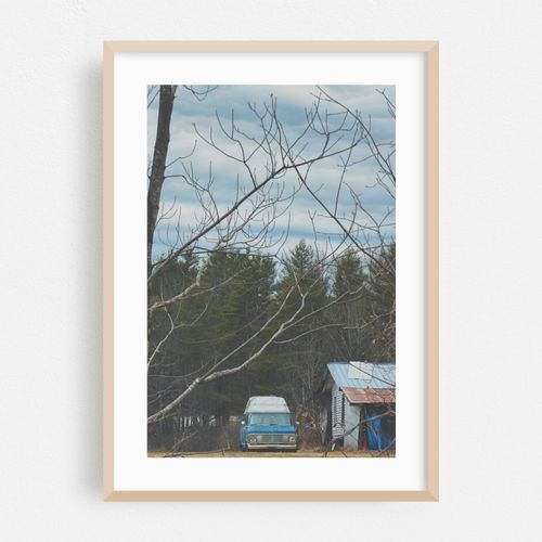 Abandoned Blue Van in the Wilderness