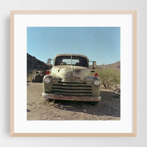Nostalgic Route 66 adventure with vintage trucks under a clear blue sky