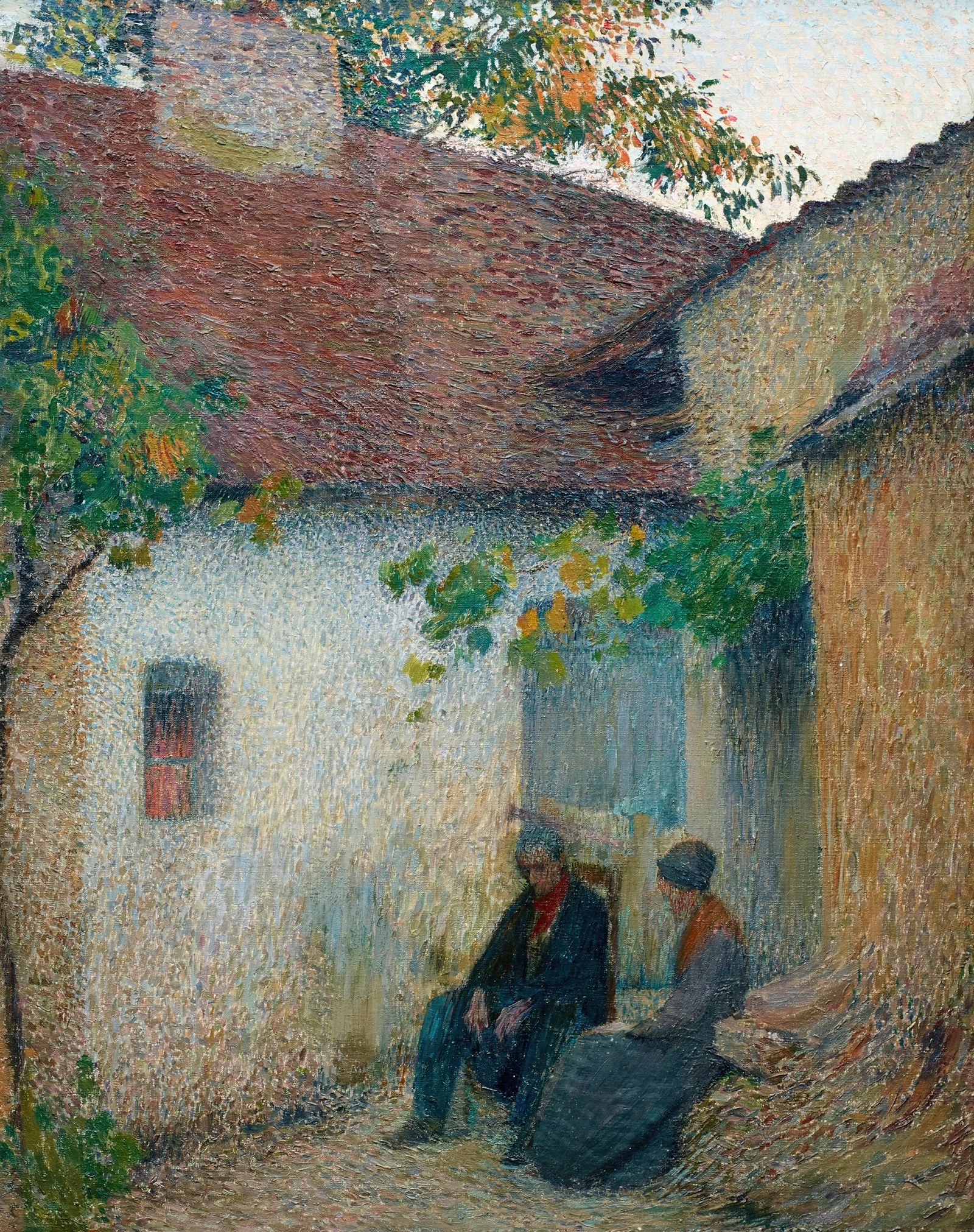 Couple en conversation devant la ferme